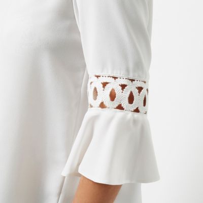 Cream crochet flute sleeve top